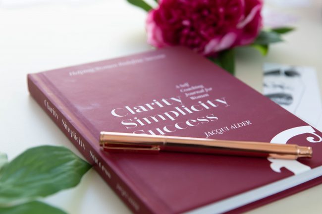 Burgundy hard cover journal with rose gold pen