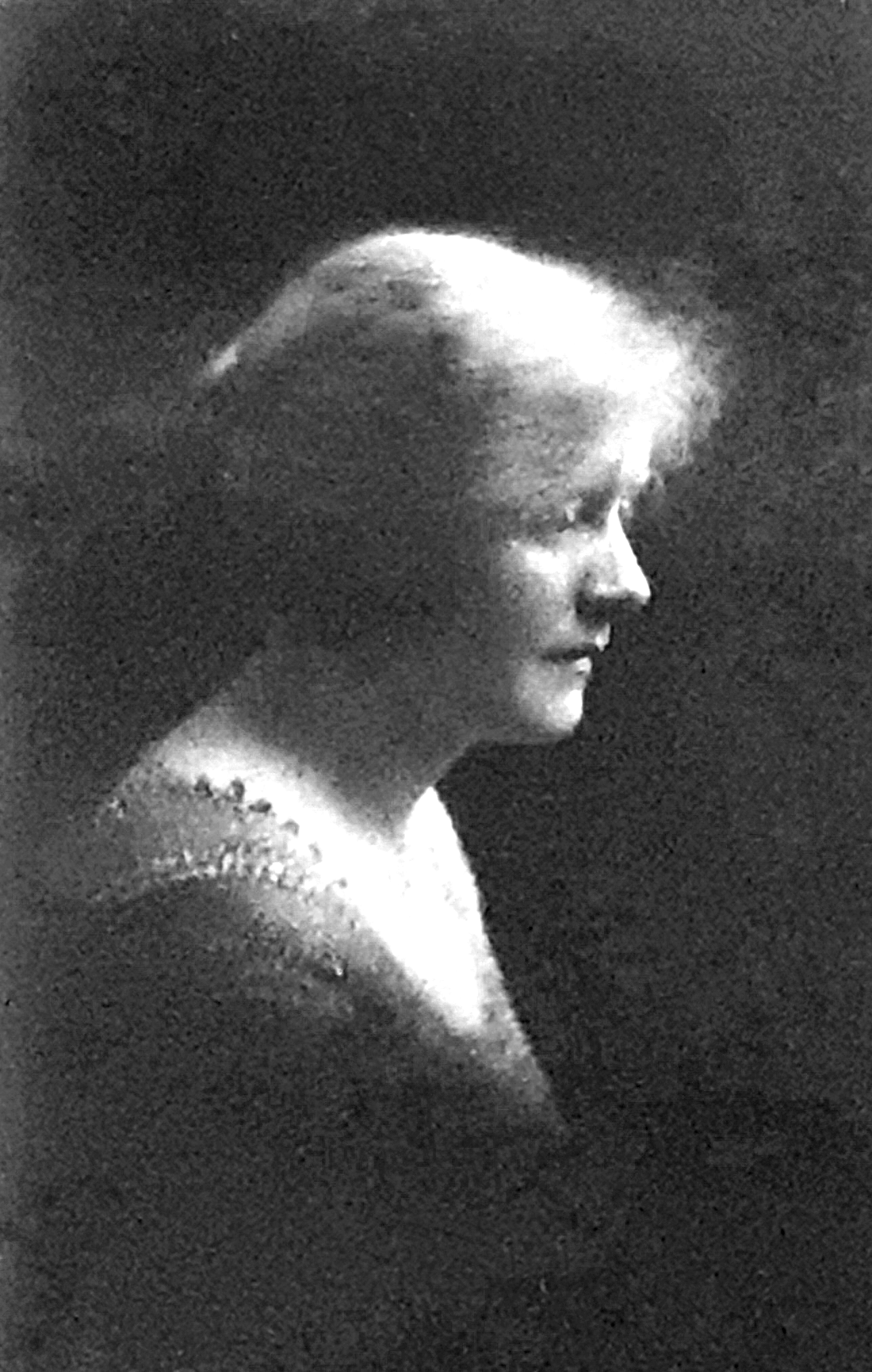 Vintage photo taken circa 1910 of blonde woman in profile